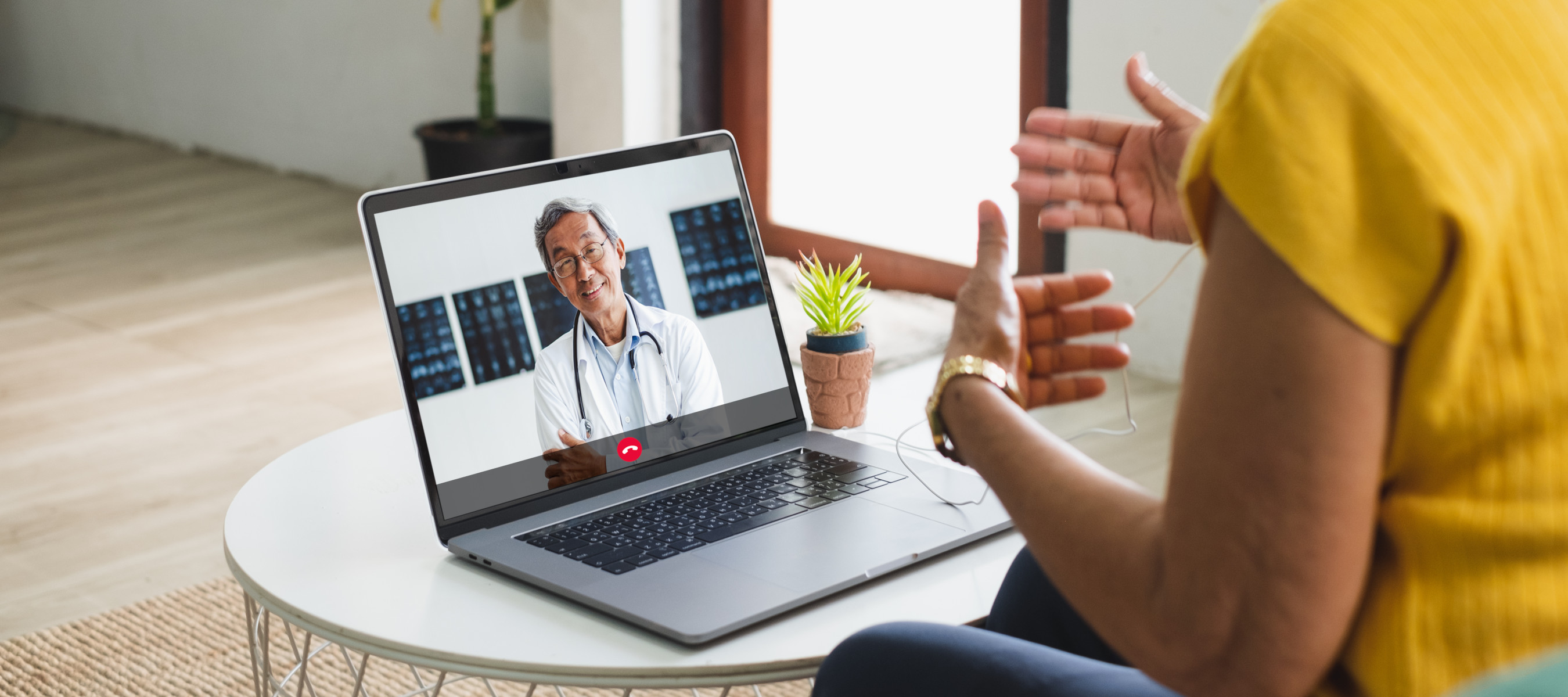 A patient having a video call with their doctor in Thailand.